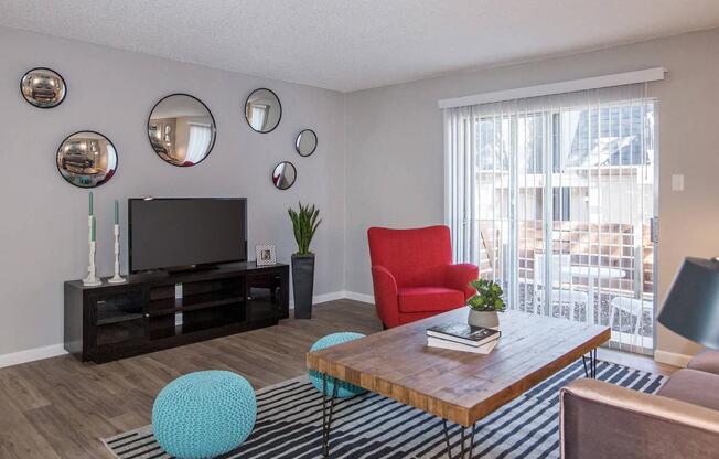 a living room with a television and a table