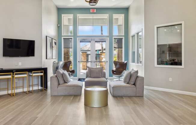 a living room with two couches and a table in front of a window