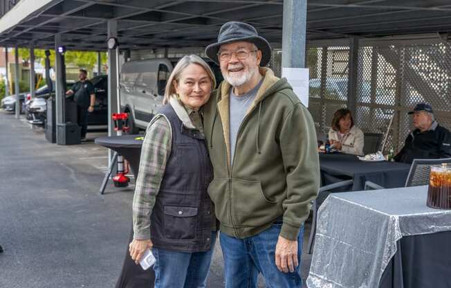 a man and a woman standing next to each other