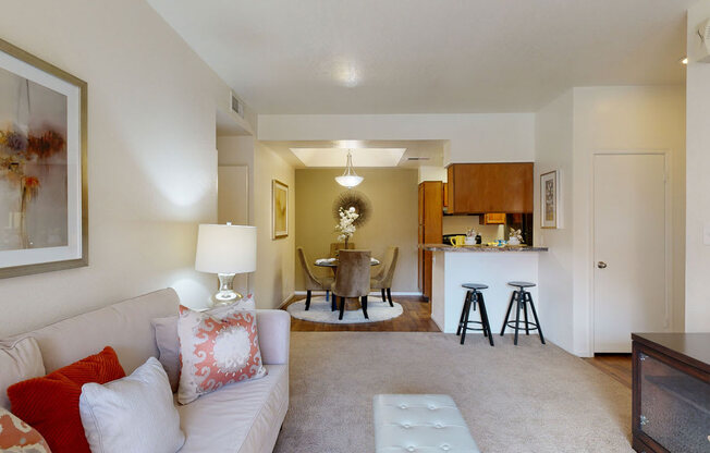 a living room with a couch and a table in the background