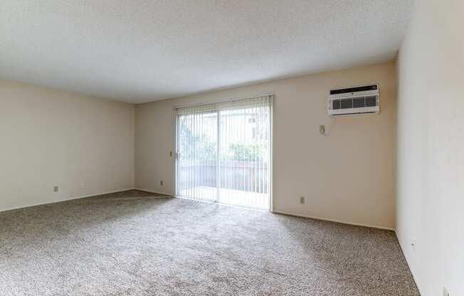 spacious room with sliding glass door