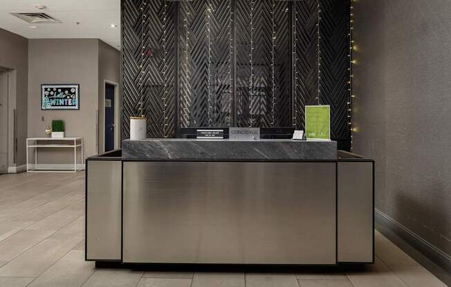 A reception desk with a green box on top of it.