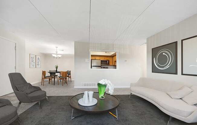 Model Living Room and Dining Room Area with Carpet at Heights Marlborough Apartments in Boston, MA.