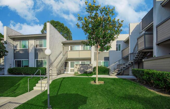 a house with a lawn in front of a building