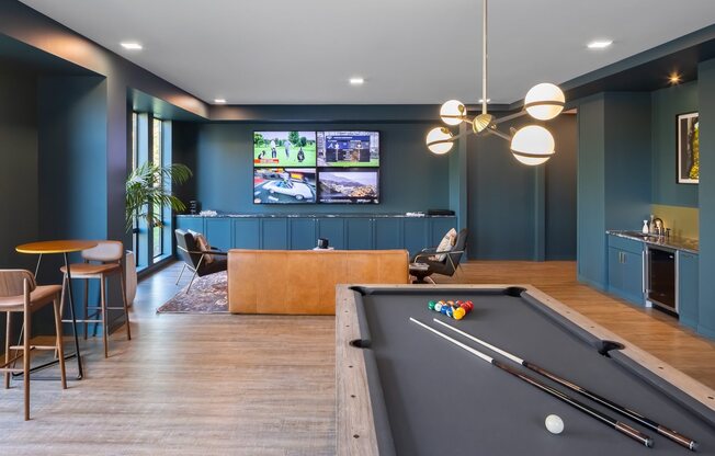 Den with pool table, wet bar, and entertainment seating
