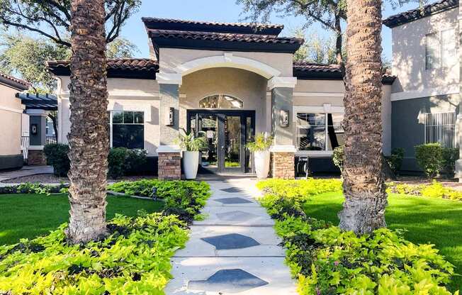 A house with a pathway leading to the front door.