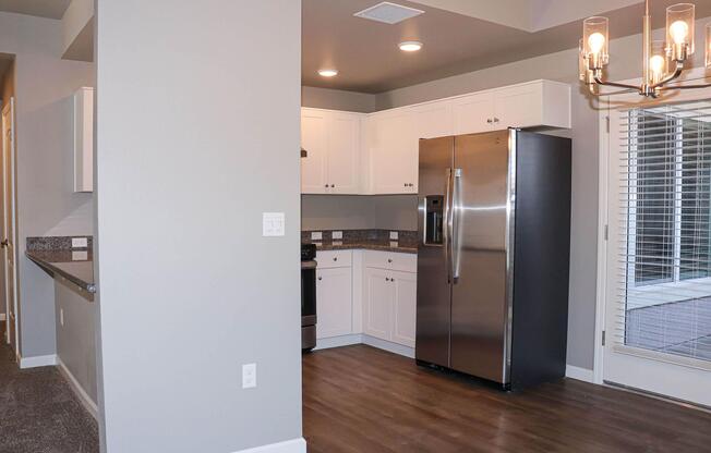 a stainless steel refrigerator in a kitchen