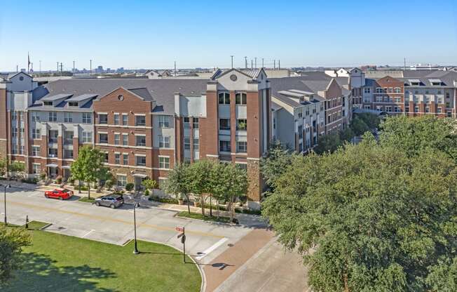 an aerial view of an apartment building on a city street