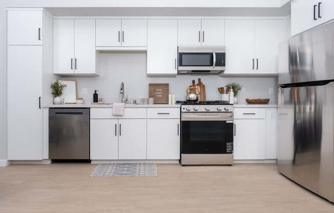 Kitchen with white cabinets and stainless steel appliances