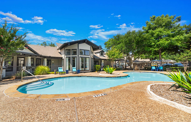 A large house with a pool in the backyard.