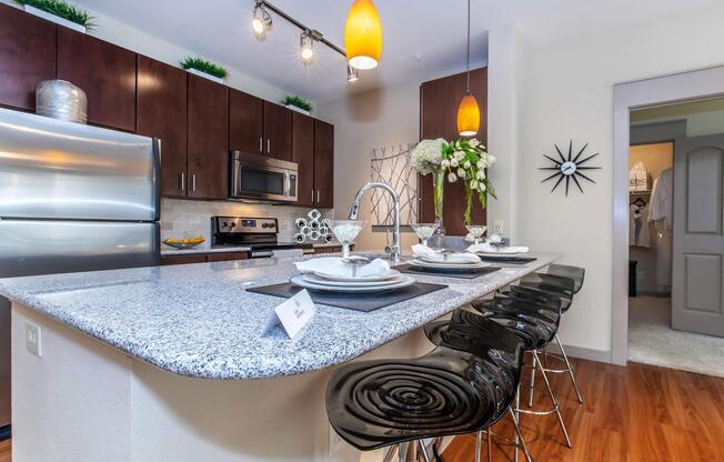 a modern kitchen with stainless steel appliances