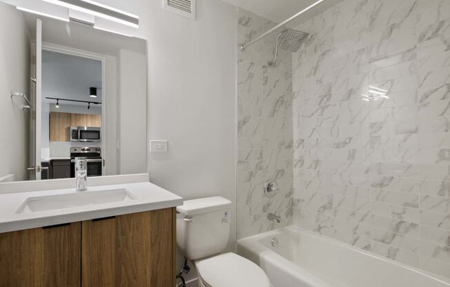 a bathroom with a sink toilet and a shower