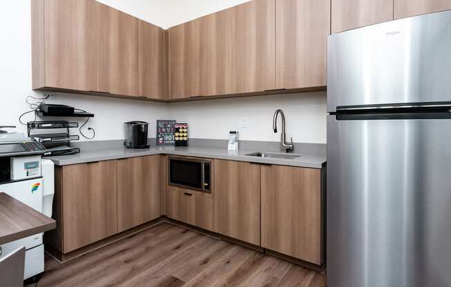 a kitchen with stainless steel appliances and wooden cabinets