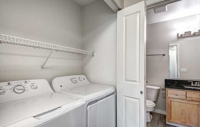 a laundry room with a washer and dryer