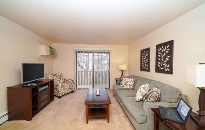 Warm and Inviting Living Room at Fairlane Apartments, Springfield, Michigan