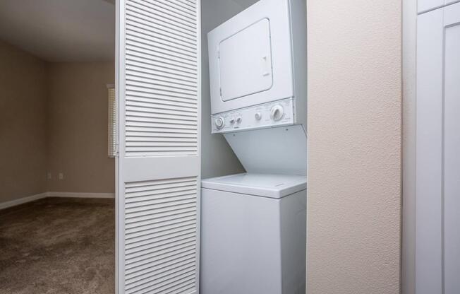 a white refrigerator freezer sitting next to a door