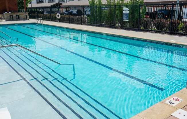 A swimming pool with lane markers and a no-diving sign.