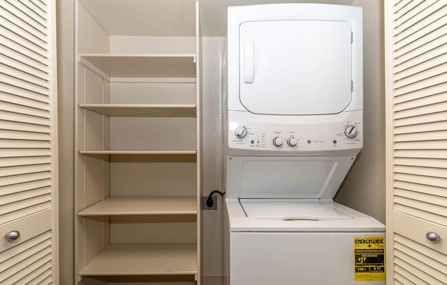 a microwave oven sitting on top of a refrigerator