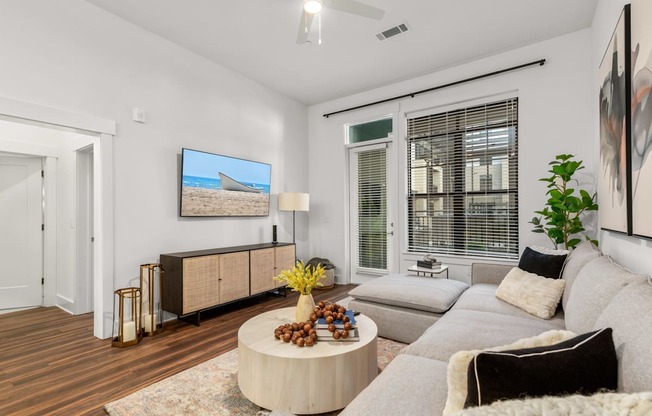 an open living room with a couch and a coffee table at The Colony, North Carolina