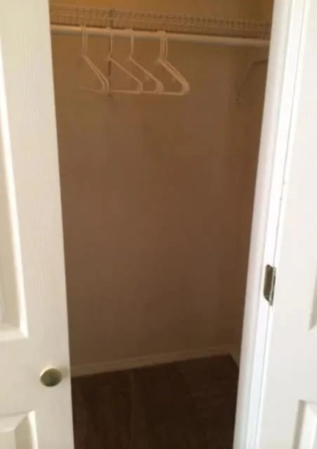 a walk in closet with a white hanger at EDGEWOOD AT GABLES Apartments, TULSA