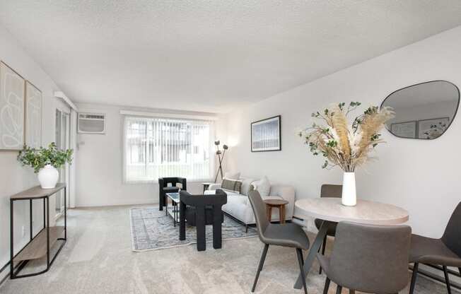 a living room with a couch and a table and chairs  at Brix, Washington