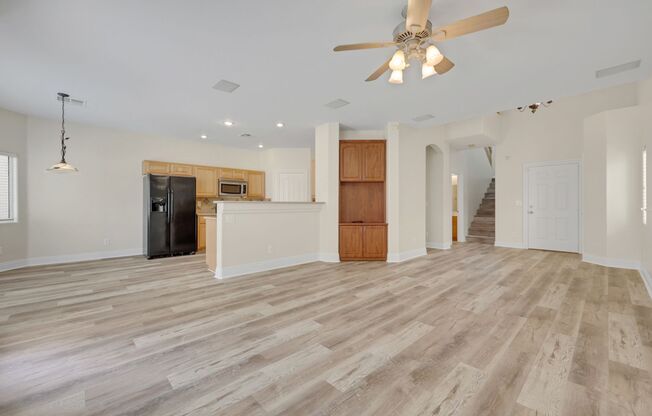 Gorgeous home with new flooring throughout and a Community Pool!