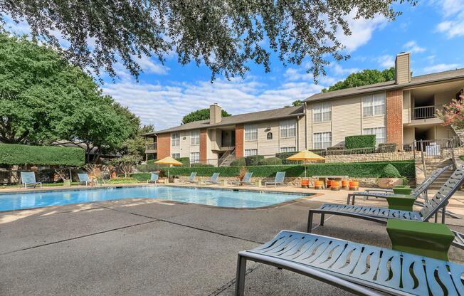 community pool with green trees