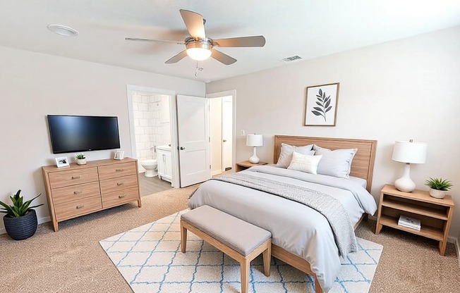 A bedroom with a bed, dresser, and tv.