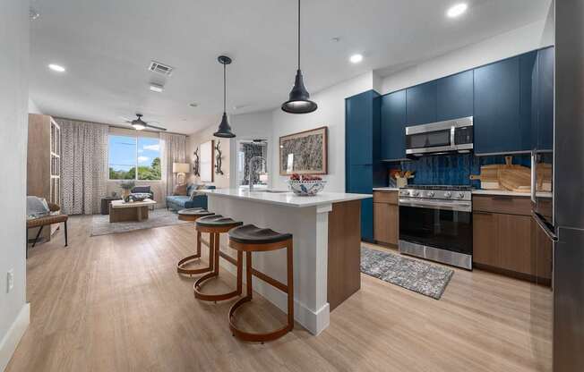 A modern kitchen with a bar area and a dining area.