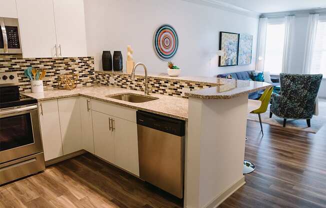 Kitchen with raised breakfast bar at Sycamore at Tyvola, North Carolina