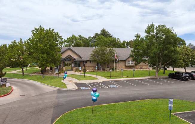 a view of the front of a house with a street and parking lot