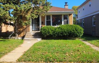 4 bed - 1 and 3/4 bath raised brick ranch with a finished basement in the West Pullman Area