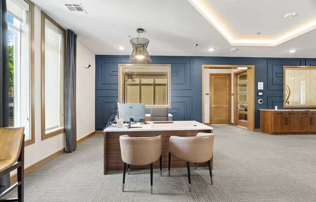 A modern office with a desk and chairs in the center.