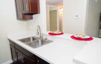 kitchen sink with bar area for eating