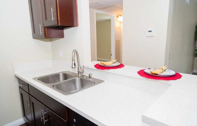 kitchen sink with bar area for eating