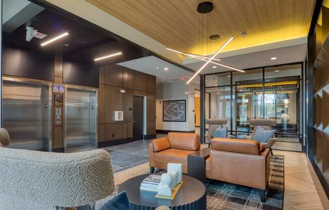 a lobby with couches and chairs and a tableat Aura Stonebridge, Richmond Virginia