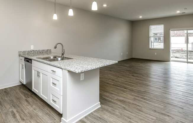 Two and three bedroom townhomes featuring golf course views, fill-size washer and dryer, stainless steel appliances, granite countertops, kitchen island, faux wood flooring and smart-home technology with keyless entry at Sandstone Villas in Omaha, NE