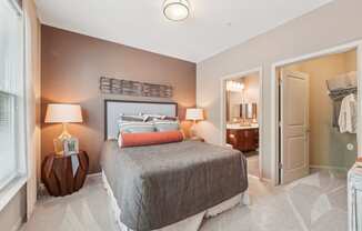 carpeted bedroom with large closet