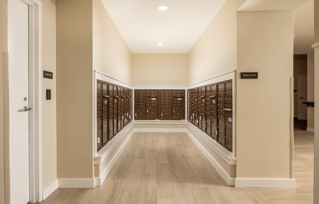 a large wine cellar with rows of wine racks and a door