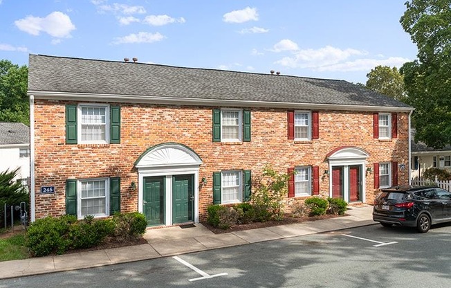 Bick with green doors and window treatment at Barracks West in Charlottesville, VA