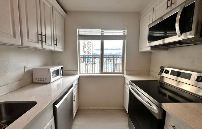 Updated 2-Bedroom Condo with Water Views, 2 Parking Spaces & Poolside Location
