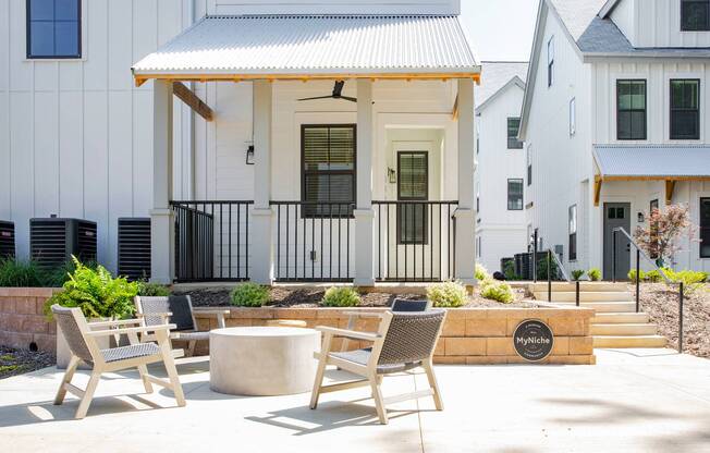 exterior patio set and townhomes on sunny day