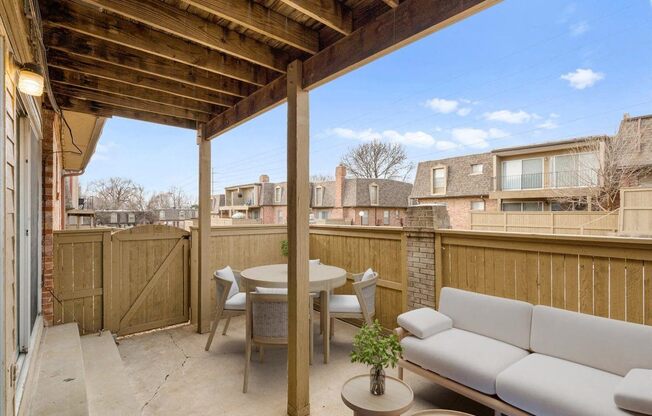 a patio with a couch and a table