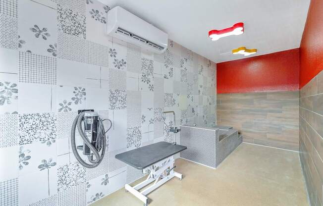 A bathroom with a shower and a bench.