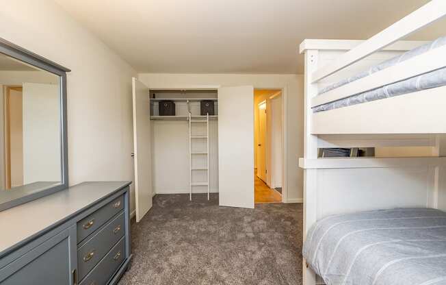 a bedroom with bunk beds and a dresser at Chapel Valley Townhomes, Baltimore, MD