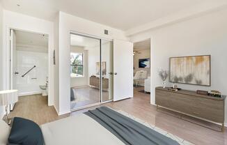 a bedroom with a bed in a room