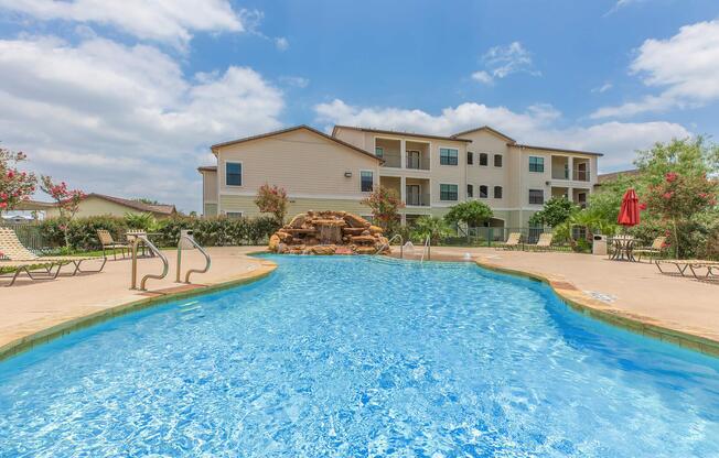 a group of people swimming in a pool of water