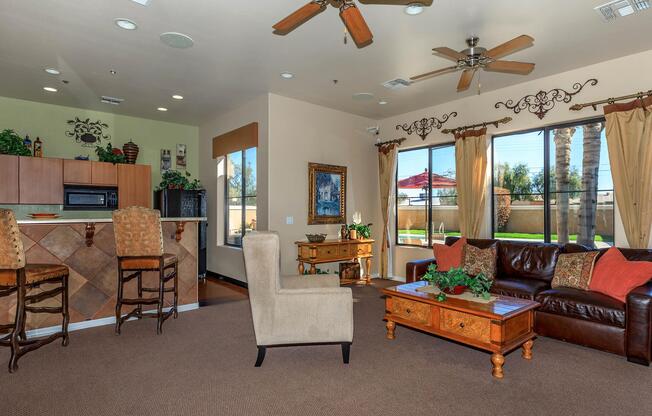 a living room filled with furniture and a large window