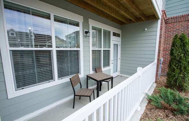A patio with a table and chairs is shown.