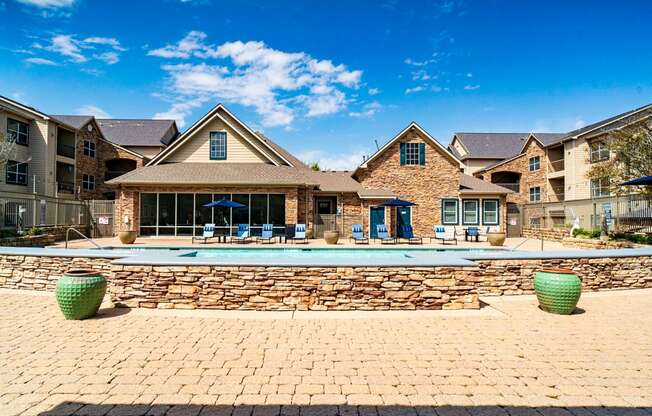a large swimming pool in front of a house